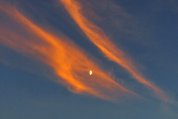 Moon amid Wispy Clouds