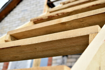 Wooden staircase at the garden house in flowers