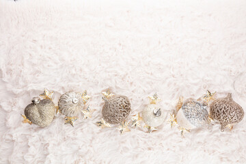 Golden christmas balls with wool background.