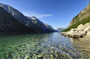 landscape of a fiord in Norway with transparent clear water