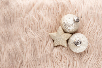 Golden christmas balls with wool background.