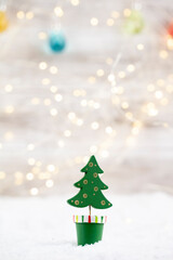 Christmas tree on wooden background.