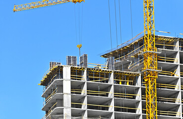 Crane and highrise construction site