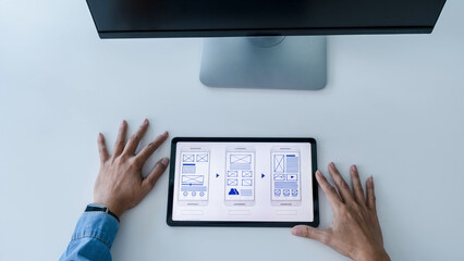 Creative Web Designer planning application and developing template layout, framework for mobile phone. User experience (UX) concept.