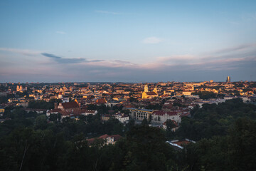 VIlnius / Lithuania - August 12 2021: View over the Old Town of Vilnius in summer at sunrise, amazing baltic touristic city in Lithuania, Europe
