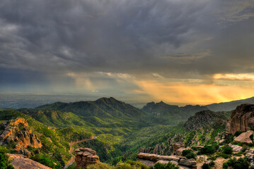 Fototapeta na wymiar Sunset over Tucson Arizona during monsoon season taken from Mt. Lemmon, Catalina HIghway