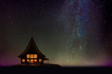 Silhouette of a cozy cabin at night overseeing Lake Superior, Upper Peninsula, Michigan, pictured...