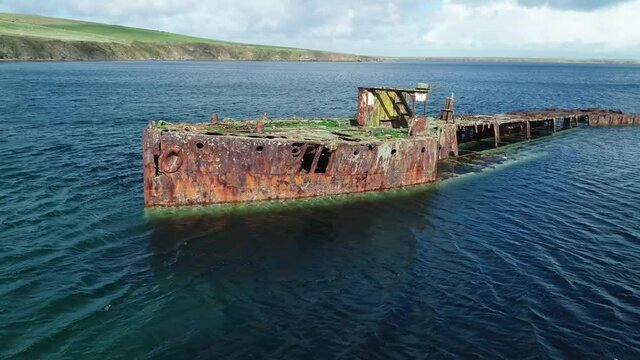Slow motion, Wreck of Juniata, an old abandoned ship at Inganess Bay on the mainland of Orkney, Scotland.