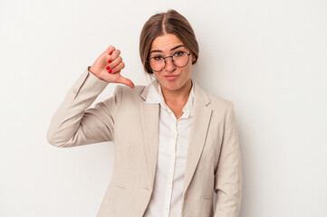 Young Russian business woman isolated on white background showing a dislike gesture, thumbs down....