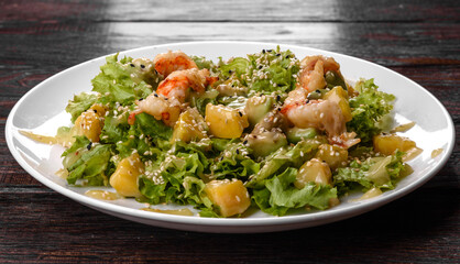 Delicious fresh salad with shrimp and pear for the festive table