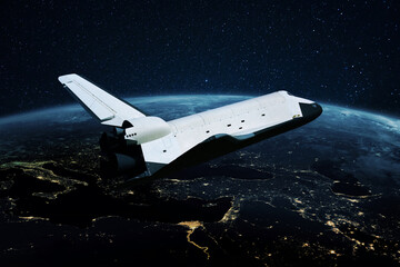 Space shuttle rocket flies in open space over the night planet earth with bright lights of megacities. Spaceship explores space. Space mission concept