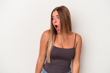 Young Russian woman isolated on white background being shocked because of something she has seen.