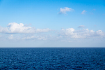 Naklejka na ściany i meble Seascape. Blue sky and white cloud.