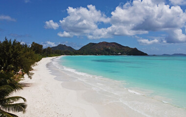 A gorgeous advertising view of the ocean coastline. Seychelles with white sand and blue lagoon