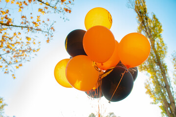 Halloween balloons in orange and black color