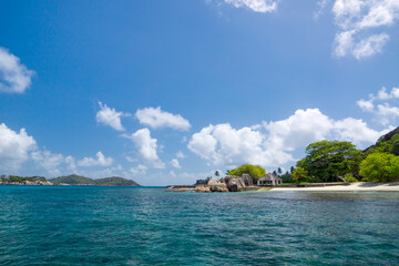Beautiful nature on the shore of the turquoise waters of the ocean. The Seychelles.