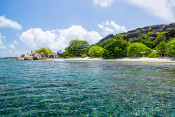 Beautiful nature on the shore of the turquoise waters of the ocean. The Seychelles.