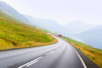 Curve of the road in the mountains to the ocean.