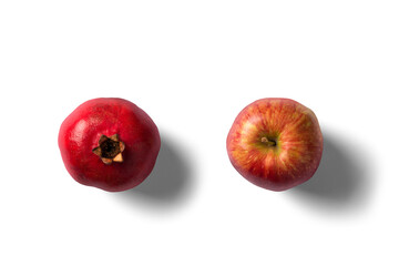 Pomegranate and apple on white background top angle