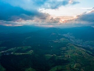 Sunset in the mountains. Ukrainian Carpathians in the evening. Aerial drone view.