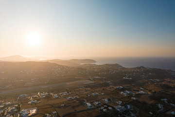 Aerial View of Sun Setting on the Horizon in Mykonos Greece