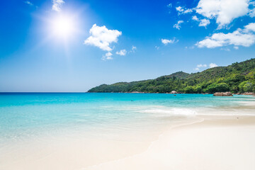 Naklejka na ściany i meble White coral beach sand and azure ocean. Seychelles islands.