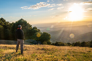 Man contemplating the sunset in the Sierra de Cazorla. Jaen. Spain