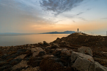 Lighthouse on the Coastline at Sunset in Mykonos Greece