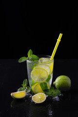 Refreshing summer alcoholic cocktail mojito with ice, fresh mint and lime