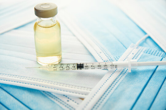 vaccine ampoule, concept of mass vaccination of the population against covid 19 Pro-Vaccine vs Anti-Vaccine problem	
