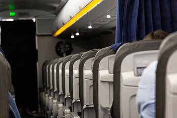 View to airplane interior with seats and isle