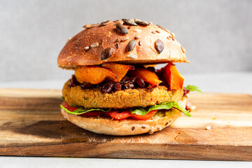 Close up of veggie burger on wooden cutting board