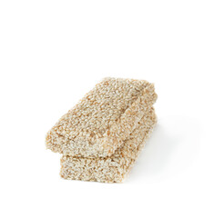 a pair of brittle bars with sesame seeds isolated on white