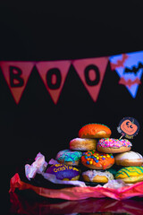 Halloween Donuts Celebration Candy Trick or Treat Spooky Dessert with Dark Background