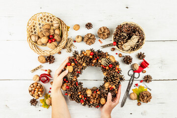 Autumn wreath of cones, nuts, and berries. Assortment from natural materials