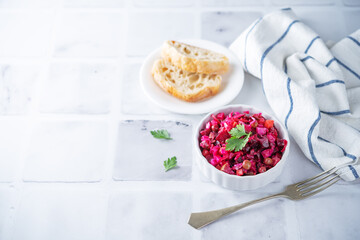 Beet potatoes green peas carrots pickled cucumbers salad