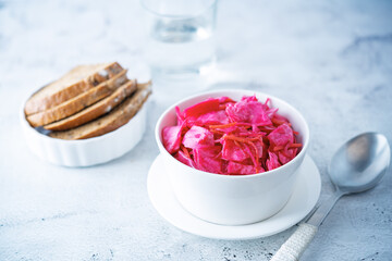 Fresh raw pickled beet cabbage with casrrot in a bowl