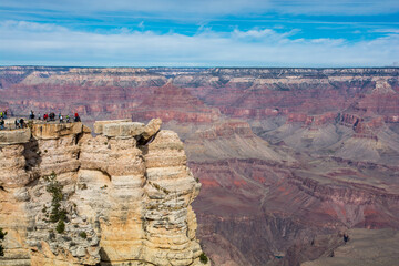 People and the Grand Canyon. Small 'toys' and amazing nature