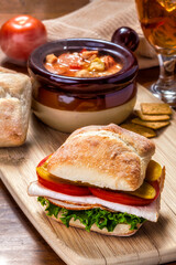Ham Sandwich on Ciabatta Roll with Crock of Hearty Soup