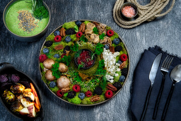 Fresh Foraged Vegetables on a Dish with Moss and Roasted Vegetables 