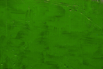 carelessly painted green flat surface - texture and full frame background