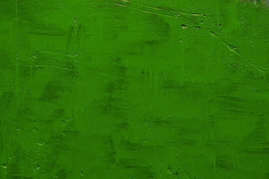 carelessly painted green flat surface - texture and full frame background