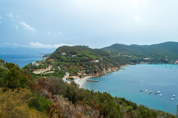 Western part of the little peninsula of Monte Enfola in Elba island in Italy with its nice big open bay 