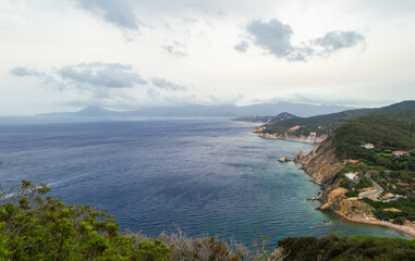 Fototapeta premium Eastern part of the little peninsula of Monte Enfola in Elba island, Italy with the Sansone beach in the back ground