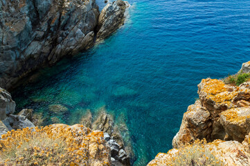 Wild sea landscape with white rocks and blue water in Monte Enfola, Elba island, Italy