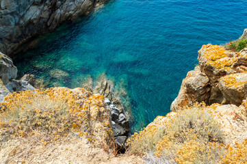 Wild sea landscape with white rocks and blue water in Monte Enfola, Elba island, Italy