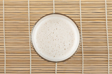 Misugaru Latte or Misutgaru in glass, top view. Healthy multi-grain smoothie. Popular Korean breakfast drink. Protein shake made from roasted multigrain powder and milk