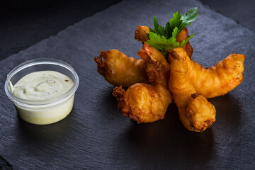 Breaded fried shrimps with mayonnaise sauce. Beer snack