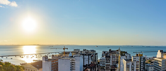 Buildings and port of the city of Salvador with the bay of All Saints in the background during sunset in Bahia state, Brazil