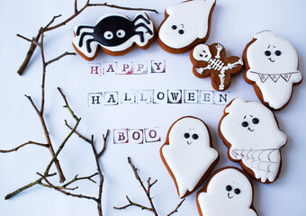 gingerbread cookies for halloween on white background and scary inscription